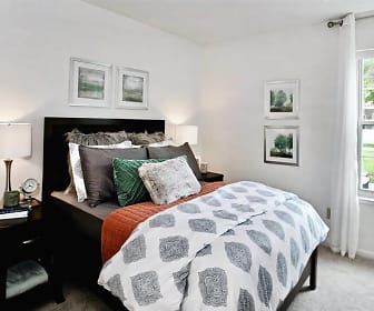 carpeted bedroom with natural light, Village Woods Apartments