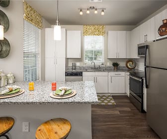kitchen featuring natural light, a breakfast bar area, refrigerator, dishwasher, range oven, microwave, granite-like countertops, white cabinets, dark parquet floors, and pendant lighting, Abberly Market Point