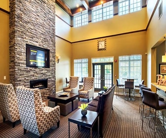 carpeted living room featuring a high ceiling, french doors, a fireplace, and TV, Waterford Nevillewood