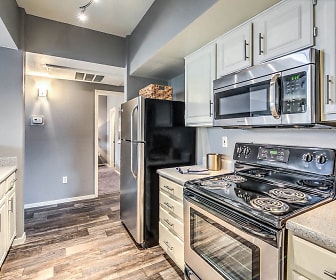 kitchen featuring electric range oven, refrigerator, dishwasher, stainless steel microwave, dark hardwood flooring, white cabinets, and light granite-like countertops, Copper Creek