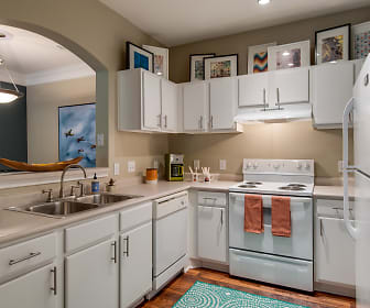 kitchen with refrigerator, dishwasher, ventilation hood, electric range oven, pendant lighting, white cabinets, light parquet floors, and light countertops, Legacy at Meridian