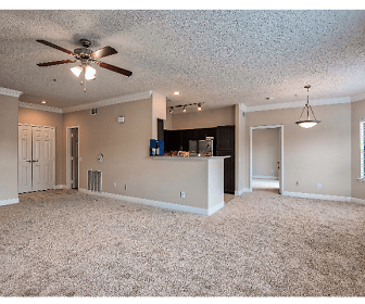 living room featuring carpet, natural light, a ceiling fan, and refrigerator, Montierra