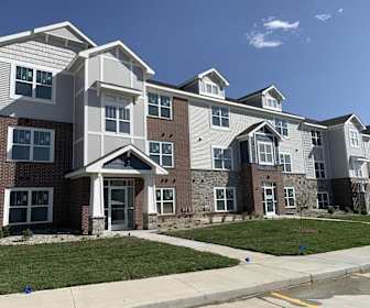 view of building exterior featuring a yard, Trade Winds