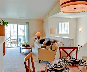 dining space featuring a wealth of natural light and carpet, The Reserve at Prairie Point & Prairie Point Apartments