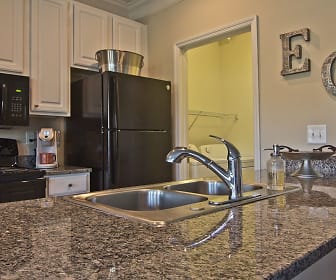 kitchen featuring refrigerator, electric range oven, microwave, white cabinetry, and dark granite-like countertops, Easton Commons
