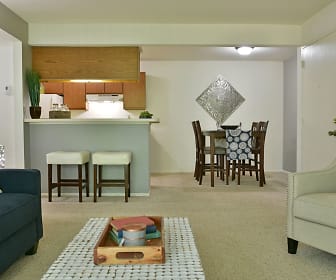carpeted living room with ventilation hood and refrigerator, Windemere