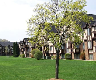 view of property's community featuring a yard, Normandy Village