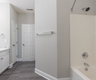 bathroom with parquet floors, tub / shower combination, and vanity, Epson Oaks