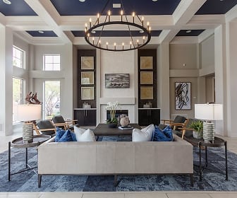 living room featuring a notable chandelier, natural light, and a fireplace, Windsor Townhomes and Apartments