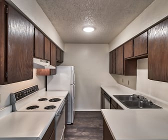 kitchen featuring refrigerator, dishwasher, ventilation hood, electric range oven, dark tile floors, dark brown cabinetry, and light countertops, Stonehill