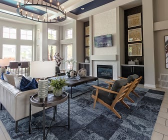 living room featuring natural light, a high ceiling, a fireplace, tile floors, and TV, Windsor Townhomes and Apartments