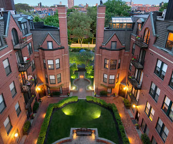 view of property featuring a lawn, Garrison Square