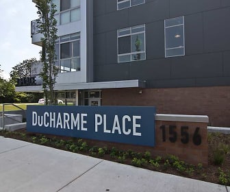 view of community sign, DuCharme Place Apartments