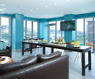living room with plenty of natural light and TV, Aqua on the Levee