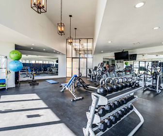 workout area with a high ceiling, parquet floors, and TV, Deercross Apartments