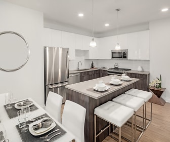 kitchen featuring stainless steel refrigerator, microwave, white cabinetry, light hardwood flooring, pendant lighting, and light countertops, Harbor Landing at Garvies Point