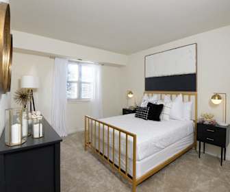 bedroom featuring carpet and natural light, Woodsdale Apartments