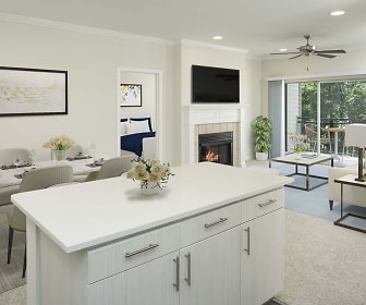 kitchen featuring a fireplace, carpet, natural light, a ceiling fan, a center island, TV, light flooring, light countertops, and white cabinetry, Camden Lansdowne