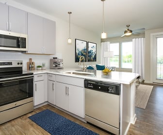 kitchen featuring a ceiling fan, plenty of natural light, electric range oven, TV, stainless steel appliances, white cabinets, light countertops, pendant lighting, and light parquet floors, 300 Optimist park