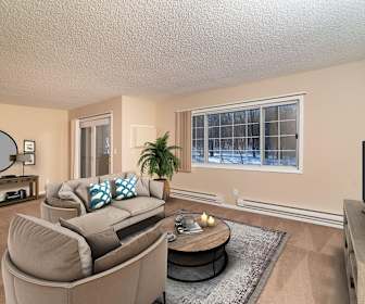 hardwood floored living room with natural light, TV, and baseboard radiator, Somerset Oaks