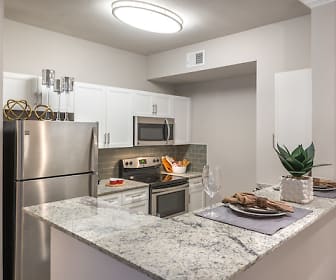 kitchen with stainless steel appliances, electric range oven, white cabinetry, and light granite-like countertops, Olympus 7th Street Station