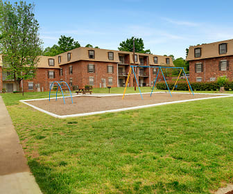 view of property's community featuring a large lawn, Lemans at Lawndale