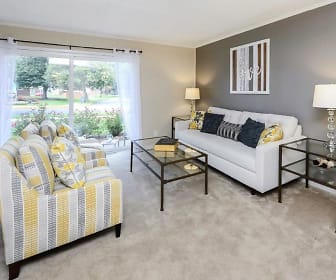 living room featuring carpet and natural light, Oxford Manor Apartments & Townhomes