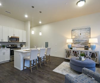 kitchen featuring stainless steel appliances, range oven, dark hardwood flooring, pendant lighting, white cabinetry, and light countertops, 200 City View