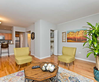 living room with a kitchen bar, parquet floors, refrigerator, and microwave, Sheridan Plaza