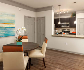 dining space featuring hardwood floors, stainless steel microwave, and range oven, Terraces at Suwanee Gateway
