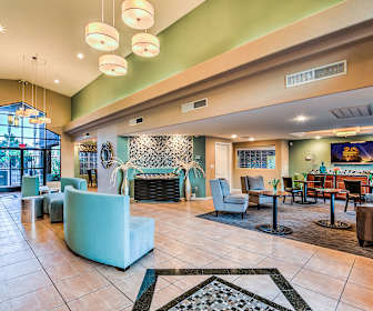 building lobby featuring tile flooring, a fireplace, and TV, Estancia