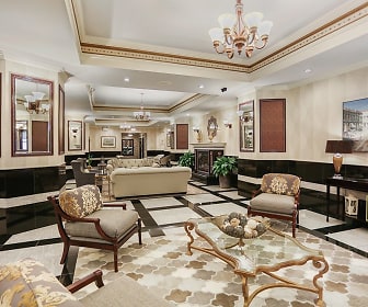 building lobby with a notable chandelier and TV, The Uptown Regency