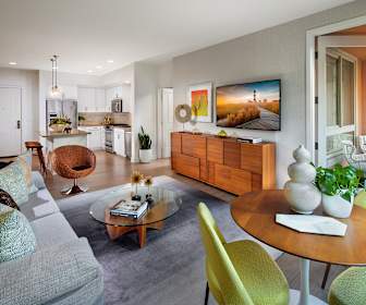 living room featuring refrigerator, TV, range oven, and microwave, Villas at Playa Vista - Malibu