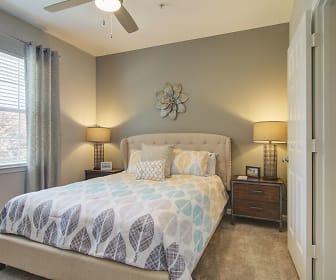 carpeted bedroom featuring a ceiling fan and natural light, Sundance Creek