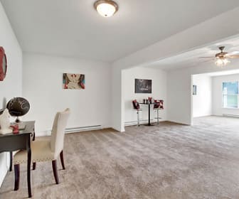 office space with a ceiling fan, carpet, and baseboard radiator, Brandywine & Woodbridge