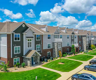 view of building exterior with a large lawn, Fieldstream Apartment Homes