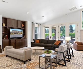 living room with vaulted ceiling, natural light, and TV, North Glen Villas