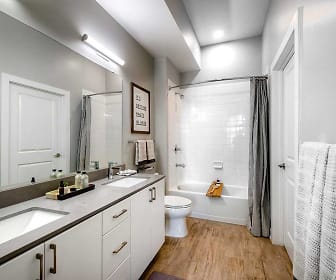 full bathroom with parquet floors, tub / shower combination, mirror, toilet, shower curtain, and double sink vanity, Avalon Woburn