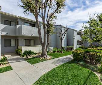 view of front of property with a front yard, Palm Court Apartment Homes