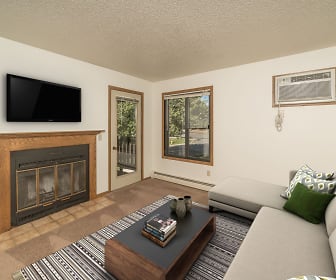 living room with a wealth of natural light, a fireplace, TV, and baseboard radiator, Terrace Hills Apartments