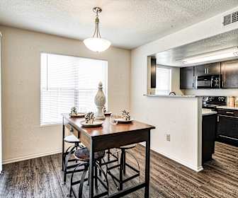 dining space featuring natural light, hardwood flooring, range oven, refrigerator, and microwave, Stoney Brooke
