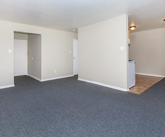 empty room featuring carpet and baseboard radiator, Chestnut Square Apartments