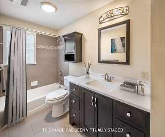 full bathroom with tile floors, mirror, toilet, washtub / shower combination, large vanity, and shower curtain, Rivercrest Apartments