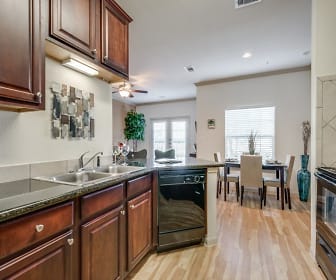 kitchen featuring natural light, a ceiling fan, dishwasher, range oven, dark countertops, light parquet floors, and dark brown cabinetry, Lookout Hollow Apartments