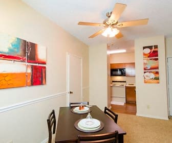 carpeted dining space featuring a ceiling fan, microwave, and range oven, Wilson Crossing