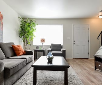 hardwood floored living room featuring natural light, Havenwood Townhomes