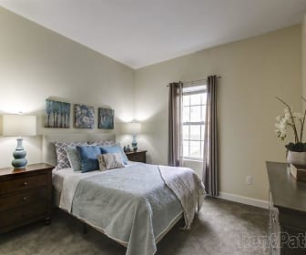 bedroom with carpet and natural light, The Brunswick Community