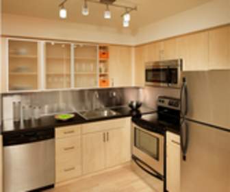 kitchen featuring hardwood flooring, stainless steel appliances, and range oven, Korman Residential At Cherrywood