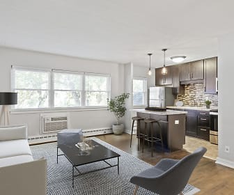 living room with natural light, hardwood flooring, baseboard radiator, refrigerator, and range oven, Minikahda Court Apartments