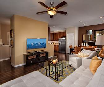 living room featuring a ceiling fan, parquet floors, refrigerator, and TV, The Enclave at Homecoming Terra Vista